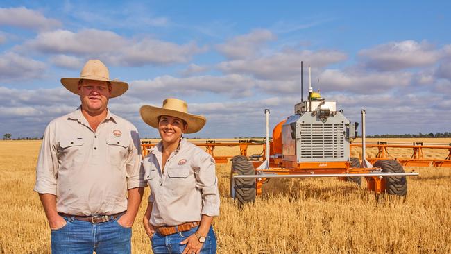 Co Founder of SwarmFarm Robotics, (left), and one of the company's robots.