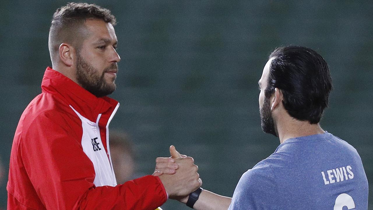 Lance Franklin shakes hands with former teammate Jordan Lewis on Friday night.