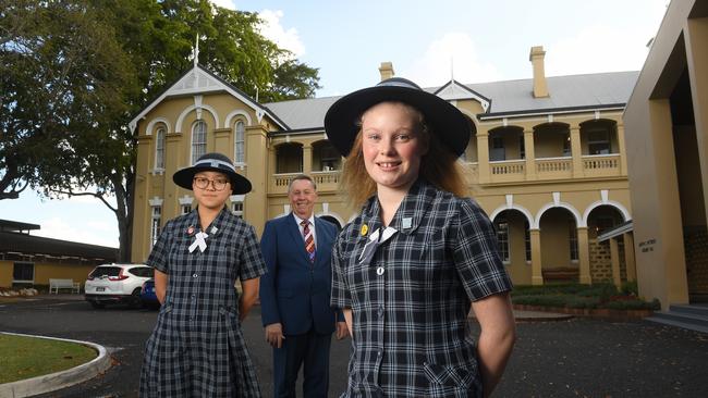 Ipswich Girls' Grammar School students Denbeigh Darnell (right) and Mandy Chui with Principal Dr Peter Britton.