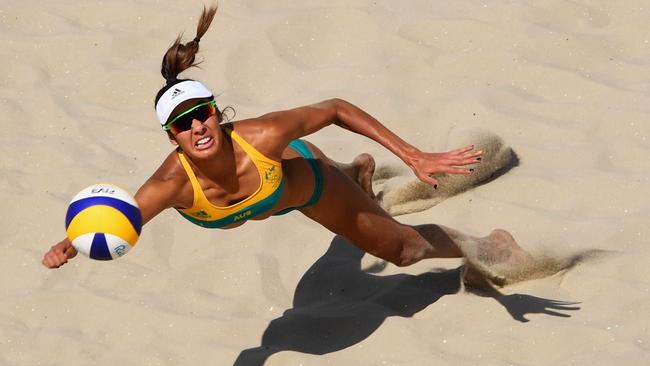 Taliqua Clancy gives it her all in leading the Aussies to victory in their first beach volleyball contest in Rio. Picture: Getty Images