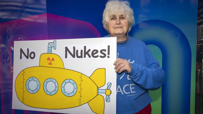 Anne McMenamin holds up a No Nukes poster at a rally against the AUKUS alliance with the message ‘No more Hiroshimas’ on the anniversary of the use of a nuclear bomb on Japan in 1945. Picture NCA NewsWire / Emma Brasier