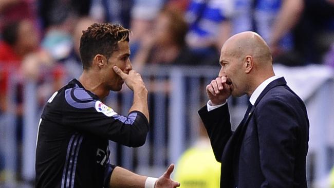 Ronaldo speaks with Real Madrid's head coach Zinedine Zidane.