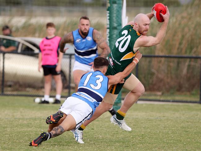 WRFL: Connor Yeoell of Wyndhamvale is tackled by Daniel Strnak of Point Cook Centrals. Picture: George Sal