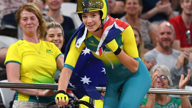 Amy Cure celebrates winning gold in the scratch race on day four of the Commonwealth Games on the Gold Coast. Picture: AAP/DAN PELED