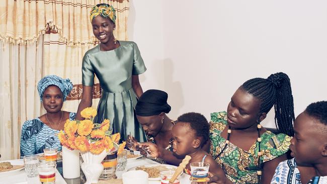 Adelaide model Adut Akech with her family at Andrews Farm, in one of the photos taken for the Vogue shoot. Picture: Vogue Australia December 2018, Adut Akech, photography by Charles Dennington