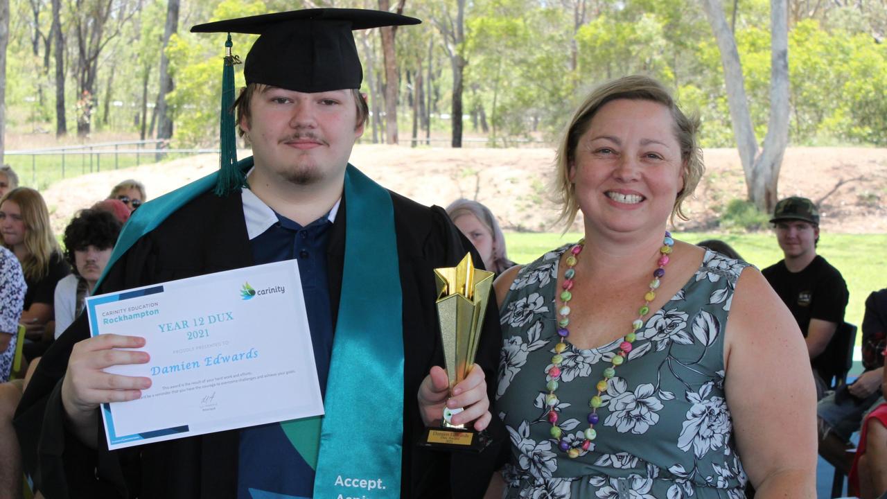 Damien Edwards, who was named the Dux of Year 12 at Carinity Education Rockhampton for 2021, pictured with school principal Lyn Harland.