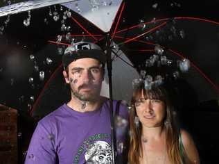 Mitch Beggs and Clare Fitzpatrick from Fingal dont like the idea of a wet summer season Photo Blainey Woodham / Daily News. Picture: Blainey Woodham