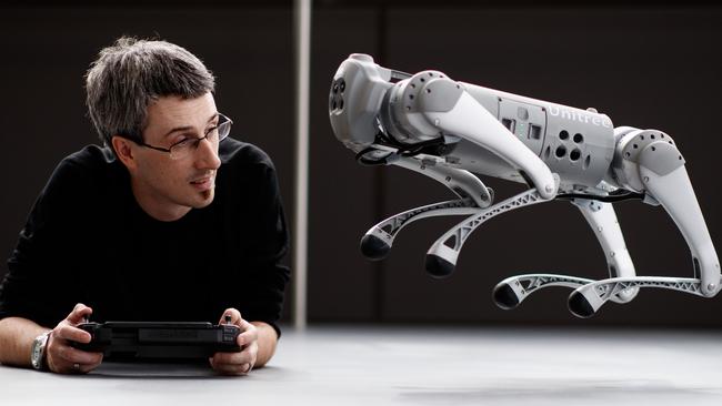 James Walsh with Clive the robotic dog at UniSA in Mawson Lakes. Picture Matt Turner.