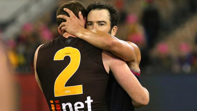 Jarryd Roughead and Jordan Lewis embrace after the game. Picture: Wayne Ludbey