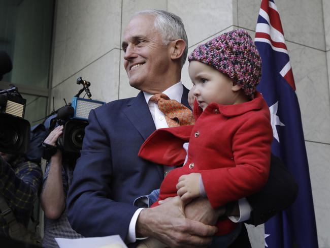 Malcolm Turnbull gives a press conference after vacating the Liberal Party leadership, with granddaughter Alice. Picture: Sean Davey.