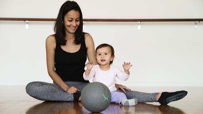 Iman Davamoni and Almira, 11 months, doing the Xtend Barre workout in Coogee today. Picture: Justin Lloyd