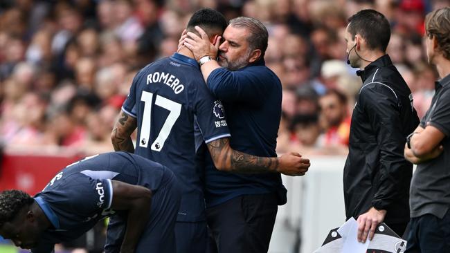 BRENTFORD, ENGLAND - AUGUST 13: Cristian Romero of Tottenham Hotspur is consoled by manager Ange Postecoglou following his substitution as a result of a concussion during the Premier League match between Brentford FC and Tottenham Hotspur at Gtech Community Stadium on August 13, 2023 in Brentford, England. (Photo by Mike Hewitt/Getty Images)