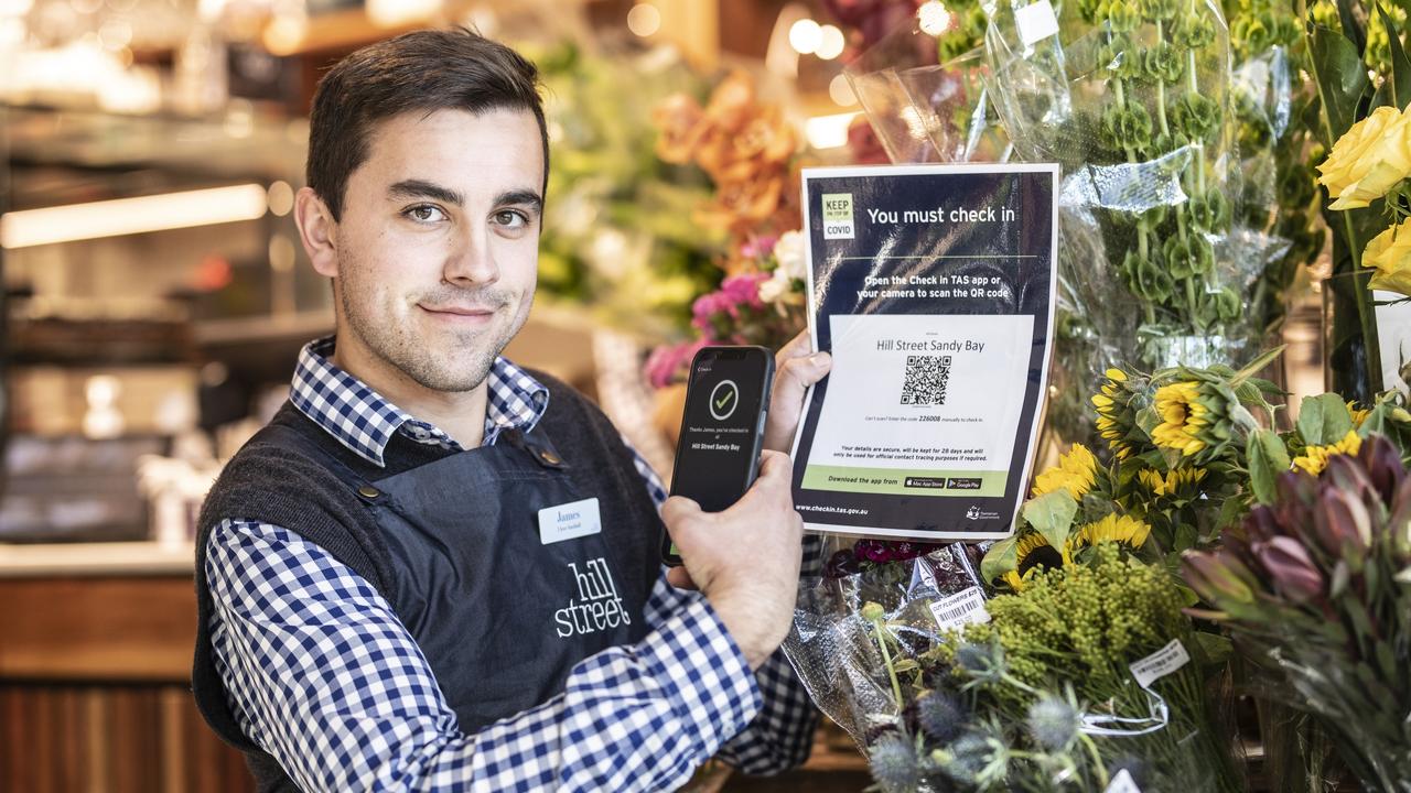 Hill Street Sandy Bay staff member James Pulford with their Check in Tas sign. Picture: Eddie Safarik