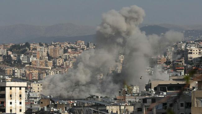 Smoke rises from the site of an Israeli airstrike that targeted the Haret Saida area, next to southern Lebanese city of Sidon on October 27, 2024, amid the ongoing war between Israel and Hezbollah. (Photo by MAHMOUD ZAYYAT / AFP)