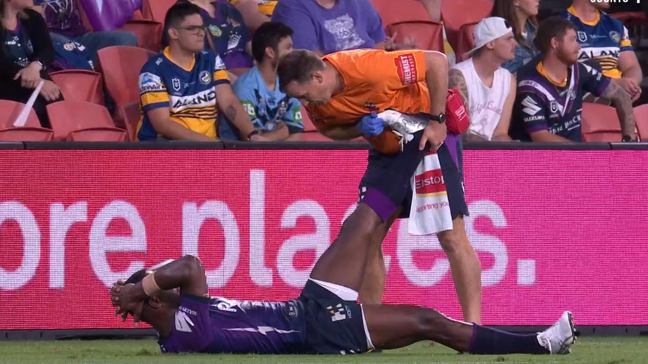 Suliasi Vunivalu is attended to by a Storm trainer to stretch out a cramp.