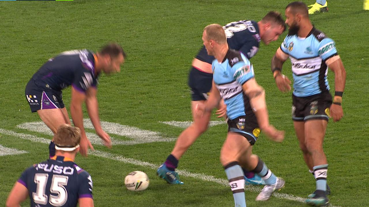 Luke Lewis watches a scuffle break out and Cameron Smith takes full advantage.