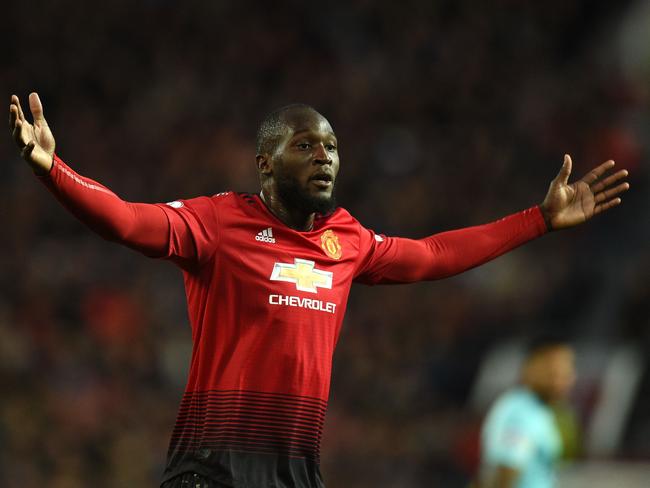 Manchester United's Belgian striker Romelu Lukaku gestures during the English Premier League football match between Manchester United and Newcastle at Old Trafford in Manchester, north west England, on October 6, 2018. (Photo by Oli SCARFF / AFP) / RESTRICTED TO EDITORIAL USE. No use with unauthorized audio, video, data, fixture lists, club/league logos or 'live' services. Online in-match use limited to 120 images. An additional 40 images may be used in extra time. No video emulation. Social media in-match use limited to 120 images. An additional 40 images may be used in extra time. No use in betting publications, games or single club/league/player publications. /