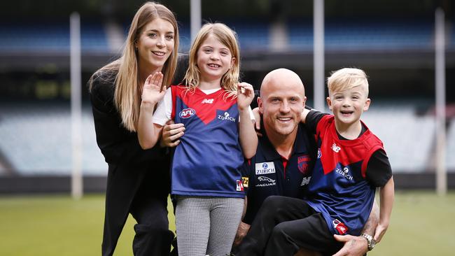 Nathan Jones with his wife Jerri and kids Bobbi and Remy at the MCG. Picture: David Caird