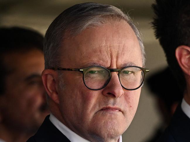 Australia Prime Minister Anthony Albanese (C) along with Industry and Science Minister Ed Husic (L) and New South Wales premier Chris Minns attend the funeral of Pakistani security guard Faraz Tahir at Baitul Huda mosque in Sydney on April 26, 2024. Pakistani security guard Faraz Tahir was one of the six victims killed at Westfield Bondi Junction on April 13, 2024 in a mass stabbing attack. (Photo by Saeed KHAN / AFP)