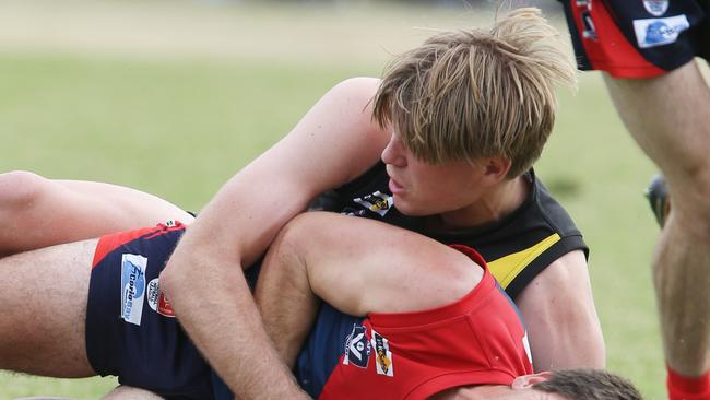 Reef Page lays a tackle for Torquay. Picture: Mark Wilson