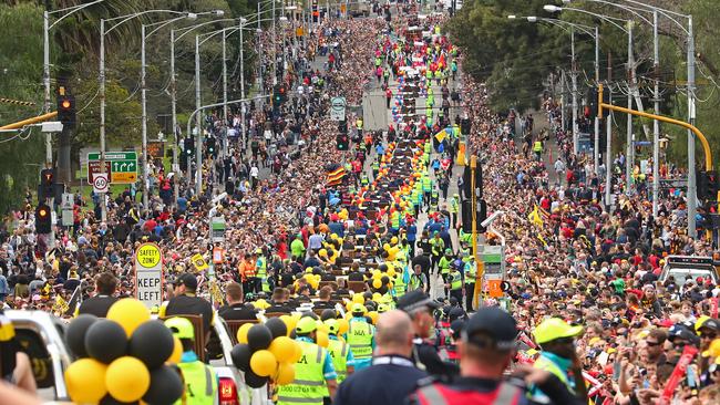 About 150,000 fans line the streets for the Grand Final parade.