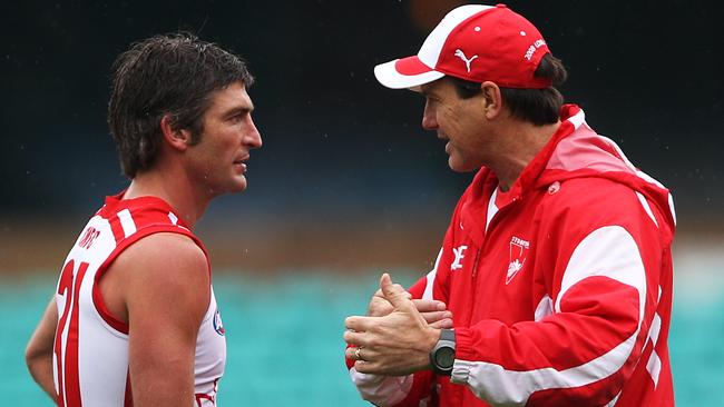 Brett Kirk and Paul Roos chat during a training session.