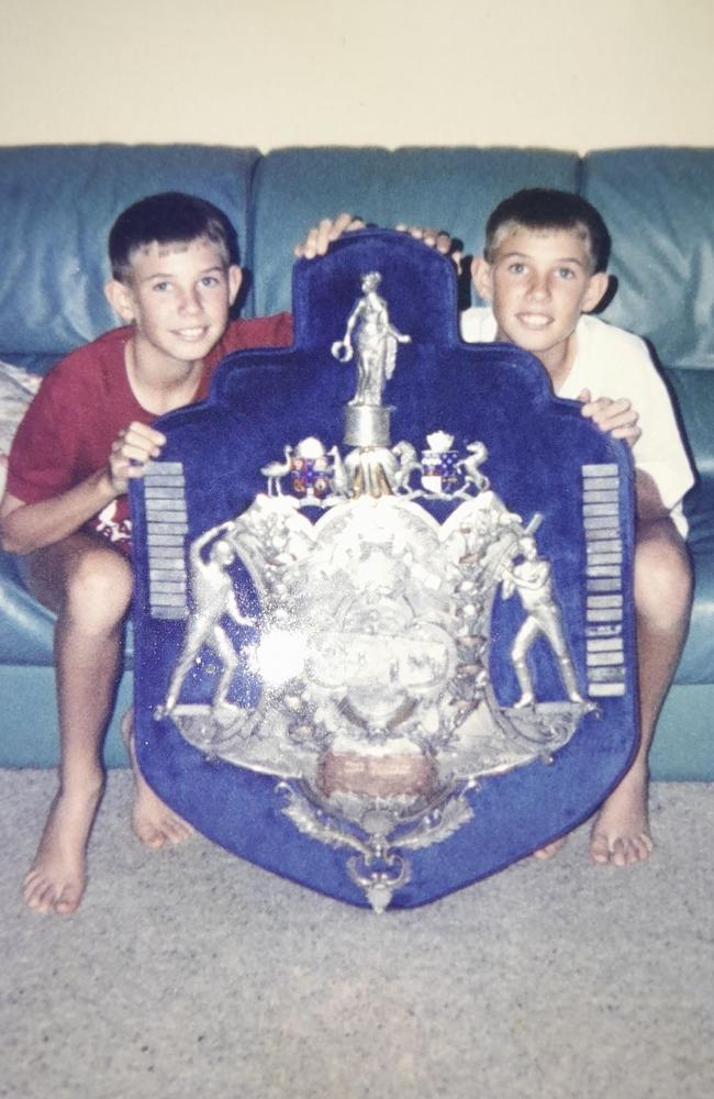 Steven and Michael Ledger as children with the 1995-96 Sheffield Shield Trophy.