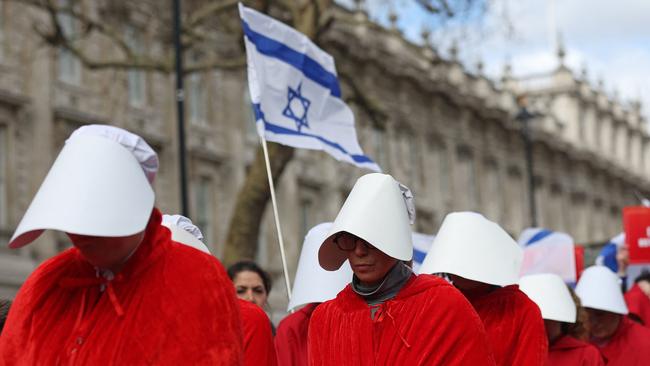 Protesters supporting women's rights, dressed as characters from The Handmaid's Tale protest against controversial legal reforms being touted by the Israel's hard-right government.