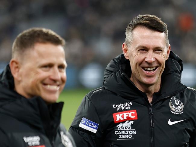 MELBOURNE, AUSTRALIA - MAY 21: (L-R) Hayden Skipworth, Brendon Bolton, Craig McRae and Justin Leppitsch of the Magpies celebrate during the 2023 AFL Round 10 match between the Carlton Blues and the Collingwood Magpies at the Melbourne Cricket Ground on May 21, 2023 in Melbourne, Australia. (Photo by Michael Willson/AFL Photos via Getty Images)