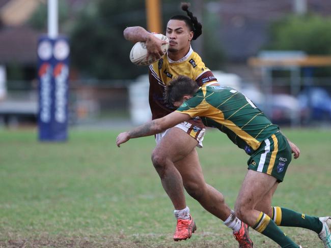 Henry Tuiafiso tackled by Windsor half Connor Mason. Picture Warren Gannon Photography