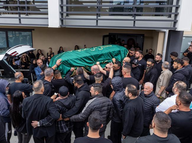 Crowds gather outside the moque as Abdulrahim’s casket is removed.