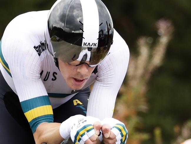 FILE - In this Sept. 25, 2019, file photo, Australia's Rohan Dennis competes on his way to win the men's elite individual time trial event, at the road cycling World Championships in Harrogate, England. At the Tour de France in July, Dennis vanished during the first stage in the Pyrenees. His worried team was forced to send a message on social media wondering about his whereabouts. The Australian rider eventually turned up at the finish line. (AP Photo/Manu Fernandez, File)