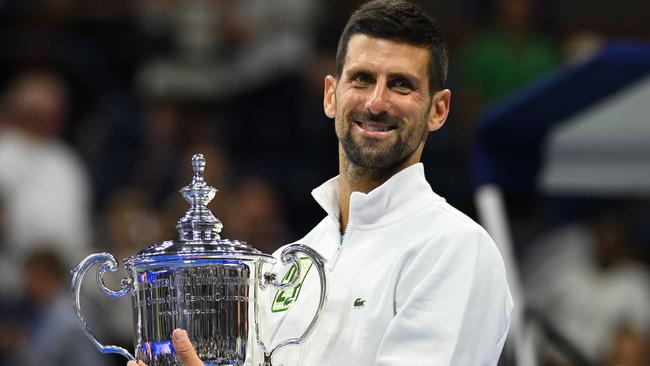 TOPSHOT - Serbia's Novak Djokovic poses with the trophy after defeating Russia's Daniil Medvedev in the US Open tennis tournament men's singles final match at the USTA Billie Jean King National Tennis Center in New York on September 10, 2023. (Photo by ANGELA WEISS / AFP)