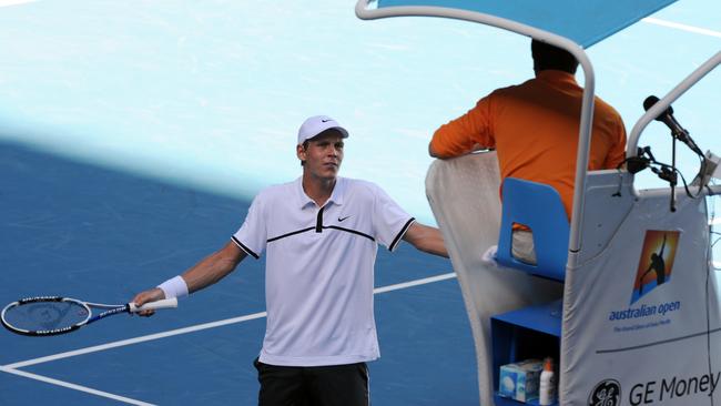 Tomas Berdych talks to the umpire late in his loss to Roger Federer.