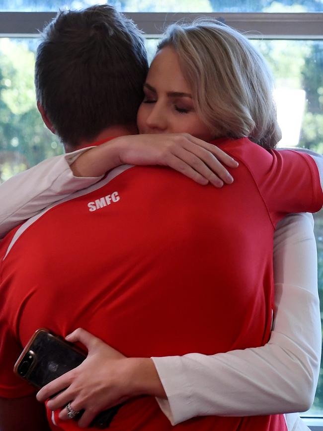 Charlotte Jack hugging her husband after his retirement announcement this week. Picture: Dean Lewins