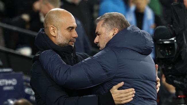 The best manager on the planet - and Pep Guardiola. Photo by Darren Staples / AFP.