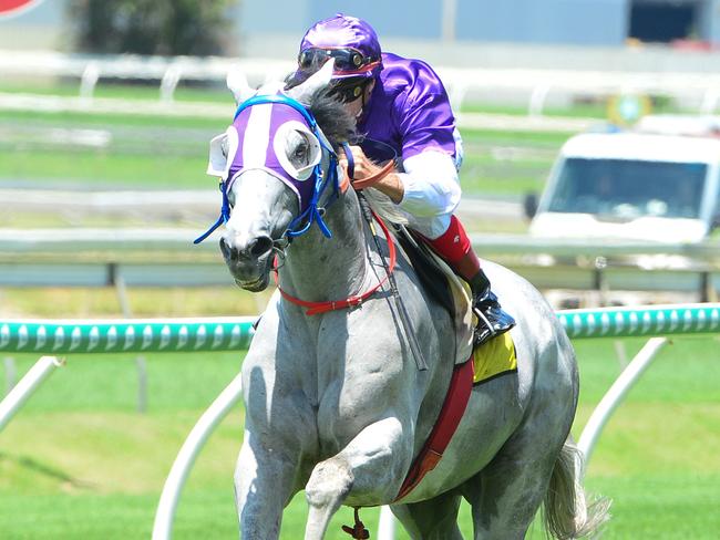 Jockey Michael Cahill rides The Candy Man to victory in race 1, the Compact Training Maiden Handicap, during Wednesday Race Day at Doomben Racecourse in Brisbane, Wednesday, December 19, 2018. (AAP Image/Trackside Photography) NO ARCHIVING, EDITORIAL USE ONLY