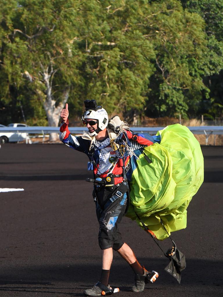 Skydivers deliver the Territory flag and Darwin Cup flag at the Darwin Cup 2022. Picture: (A)manda Parkinson