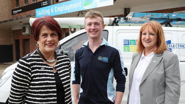 Judith Field (Community Partnerships Manager with Lendlease), Fourth Year Apprentice Jono Owen, 22 and Lea Hix (General Manager of Hix Group) pose for a photo at St Mary's Skills and Employment Centre. Leandlease has developed the employment hub in St Mary's to help residents find work. (AAP Image/David Swift)