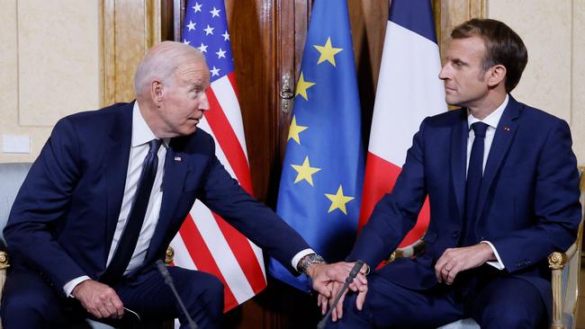 Paying tribute: Joe Biden reaches out to Emmanuel Macron in Rome last week. Picture: AFP