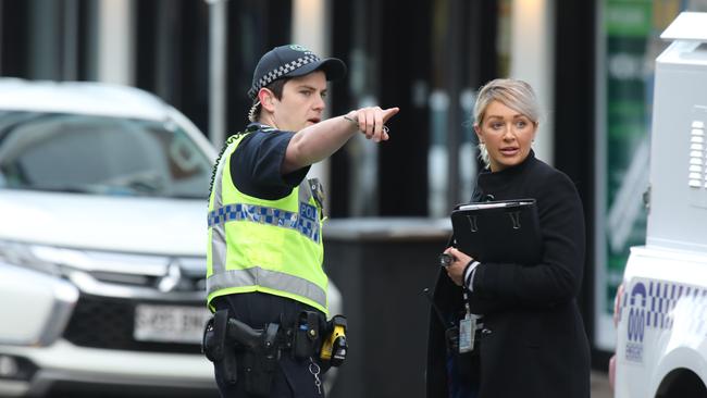 Police and detectives on Hindley St investigating the assault early on Sunday morning. Two men have been charged. Picture: AAP / Dean Martin