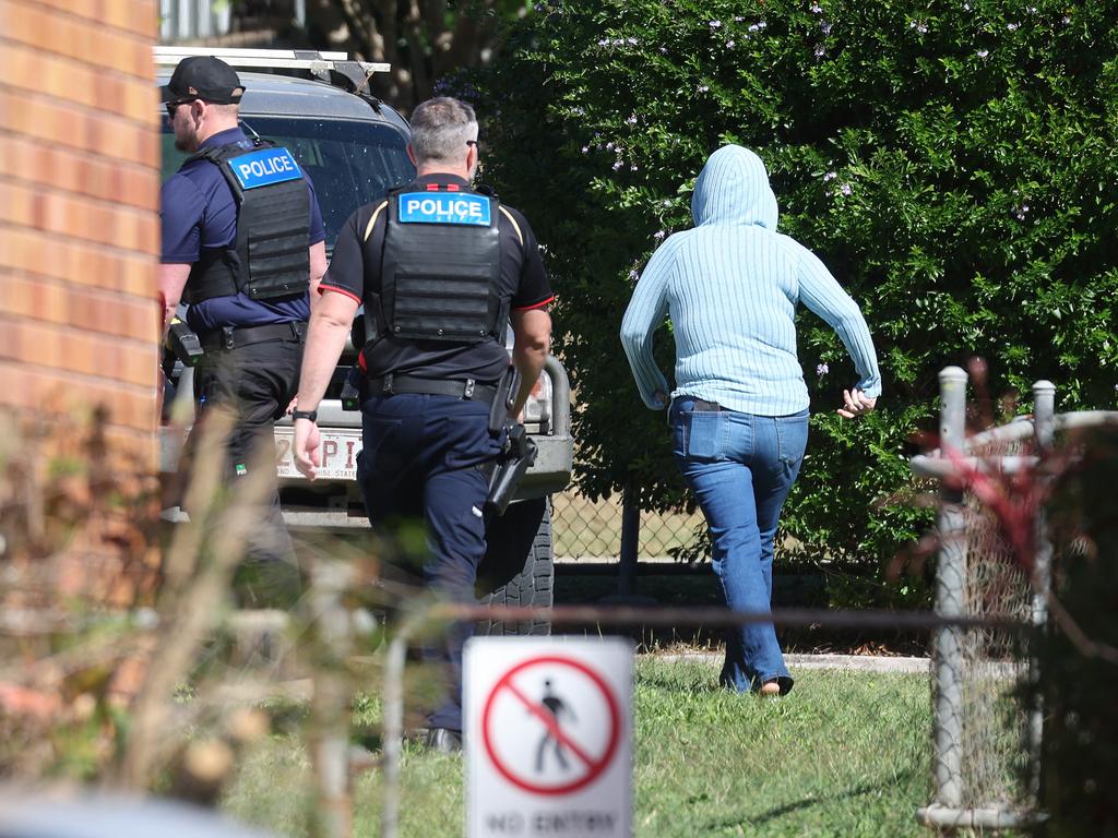Tanika Bromley escorted to her car by police at the Gin Gin police station. Picture: Liam Kidston