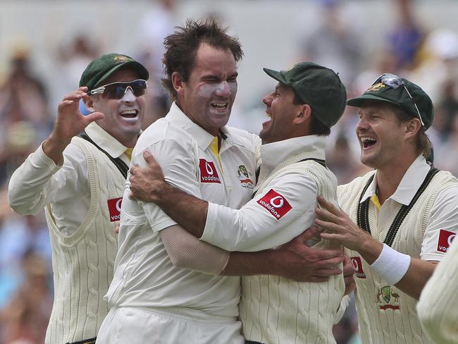 Australia's John Hastings celebrates with Ricky Ponting after taking the wicket of South Africa's AB de Villiers in the third Test match in Perth in 2012. Picture: Rob Griffith