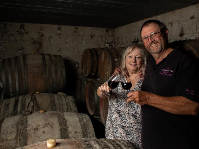 Crane Winery owners and winemakers Bernie and Judy Cooper celebrate their retirement at the vineyard near Kingaroy. Picture: Dominic Elsome