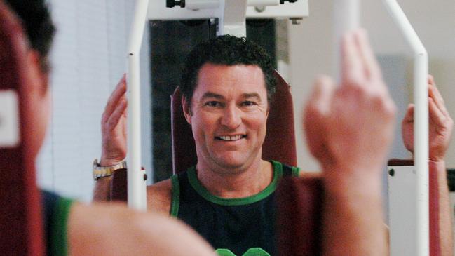 Member for Surfers Paradise John-Paul Langbroek resuming his gym session after being caught in his gym gear in Queensland Parliament when a Division Bell was called. (AAP Image/Dave Hunt)