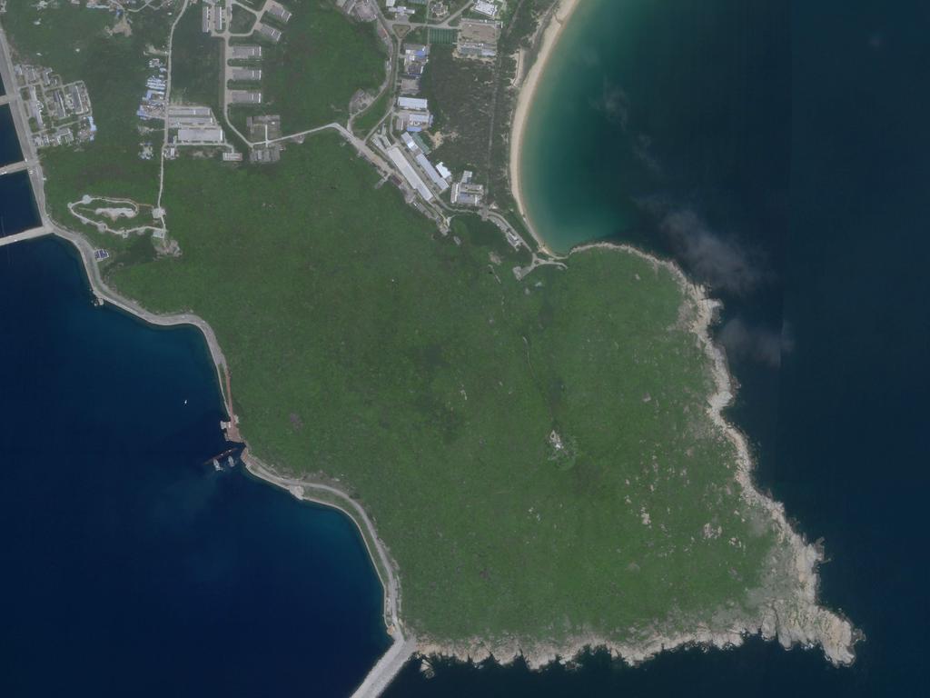 This August 18, 2020, image courtesy of Planet Labs, Inc., shows a Chinese submarine (C, bottom) entering an underground base on Hainan Island in the South China Sea. Picture: Planet Labs, Inc. / AFP