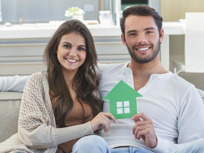 A young couple who have bought their first home and have a mortgage. They are working hard to pay down their home loan. Picture: iStock.