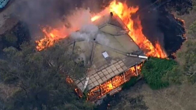 A property goes up in flames surrounding Jinks Creek Winery, near Bunyip. Picture: @DougalBeatty/Twitter