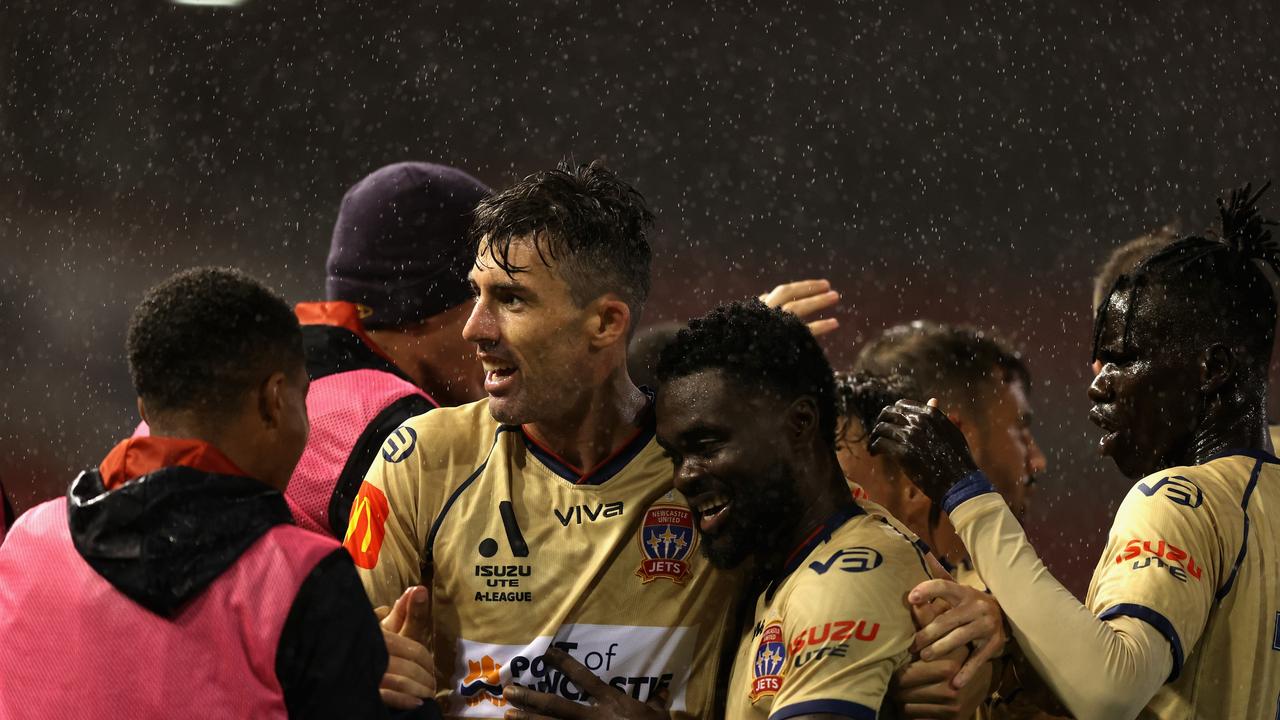 The Jets celebrate during their 2-1 win over the Roar. Picture: Ashley Feder/Getty Images