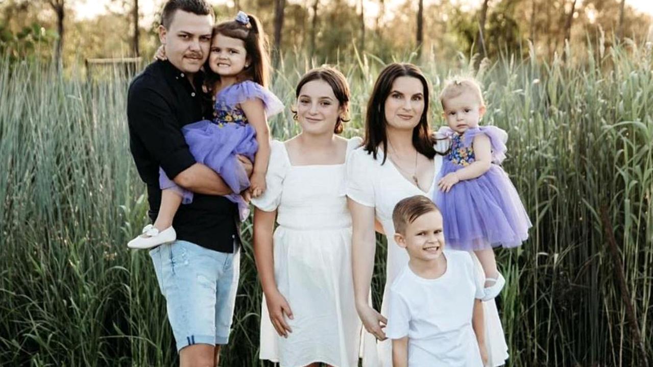 Family photo of Tahlia Brown (R) holding daughter Taidyn "Totty" Murphy.